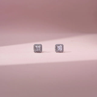 Front view of princess-cut lab-grown diamond halo stud earrings in 14 KT white gold, featuring princess-cut centre diamonds surrounded by square pavé-set diamond halos in a timeless elegant design.