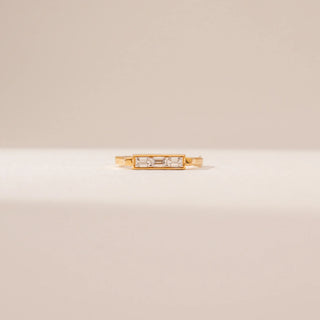 Front view of a 14KT Yellow Gold diamond ring featuring a rectangular bezel setting with baguette-cut and round diamond accents.