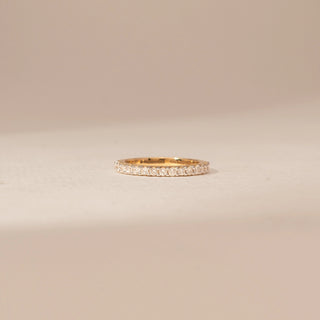 Front view of a 14KT Yellow Gold diamond ring with a full diamond-set band featuring round diamond accents.