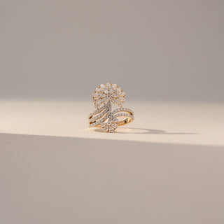 Front view of Floral Cluster Diamond Ring in 14KT Yellow Gold, featuring pear-shaped lab grown diamonds forming a bloom with pavé bands. Set on a beige backdrop, the design highlights intricate detail and brilliance.
