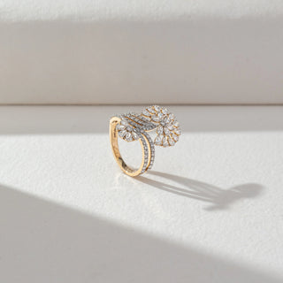 Side view of Floral Cluster Diamond Ring in 14KT Yellow Gold, featuring pear-shaped lab grown diamonds forming a bloom with pavé bands. Set on a beige backdrop, the design highlights graceful curves and brilliance.
