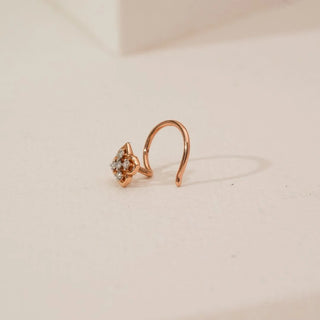 Side view of floral cluster lab-grown diamond nosepin in yellow gold, featuring four round diamonds forming a flower motif with a smooth curved hook and polished finish.