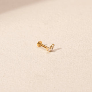 Angled view of Twin Pear Diamond Nosepin in 14KT Yellow Gold, featuring a  marquise-shaped lab-grown diamond in a prong setting.