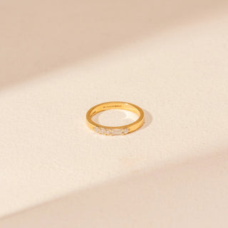 Top view of Minimal Diamond Band Ring in 14KT Yellow Gold, featuring a slim band with round and baguette diamonds.