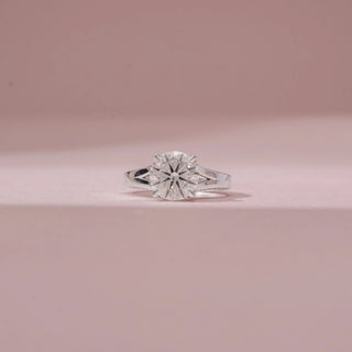 Front view of a 14KT White Gold diamond ring, featuring a round centre diamond and a sleek sculpted band.