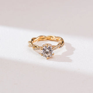 Top view of Twisted Gold Solitaire Diamond Ring in 14KT yellow gold, featuring a round six-prong centre diamond and pavé-set twisted infinity band.