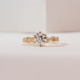 Front view of Twisted Gold Solitaire Diamond Ring in 14KT yellow gold, showcasing a round six-prong centre diamond with a pavé-set twisted band.