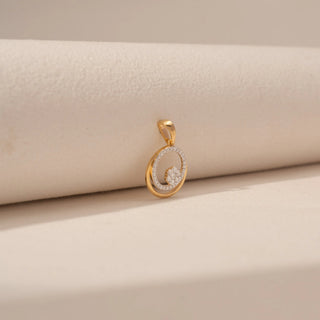 Side view of Round Diamond Circle Pendant in 14KT Yellow Gold, featuring a pavé diamond circle and floating diamond cluster.