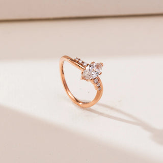 Side profile view of Modern Yellow Gold Diamond Ring in 14KT yellow gold, featuring a vertically set marquise centre diamond with round accent diamonds along a softly curved polished band.