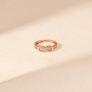 Top view of Infinity Diamond Ring in 14KT Rose Gold, featuring intertwined loops and a pavé diamond band.