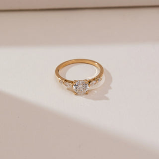 Top view of Classic Tapered Accent Diamond Ring in 14KT yellow gold, featuring a round centre diamond with marquise-shaped tapered side accents on a slender polished band.