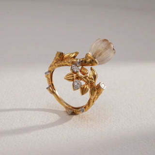 Side view of Blooming Floral Diamond Statement Ring in 14KT Yellow Gold, featuring carved translucent bud, golden vine band, and EF VVS round diamonds for a nature-inspired, elegant design.