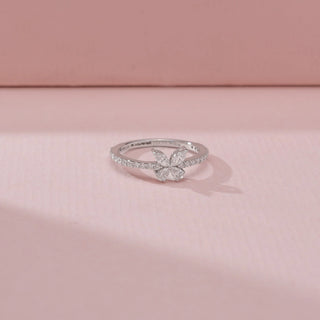Side view of a 14KT White Gold diamond ring, featuring marquise diamonds arranged in a floral design.