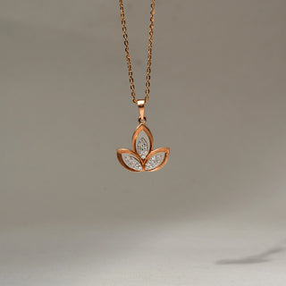 Front view of a rose gold floral pendant necklace featuring three petal-shaped motifs with pavé diamond accents, suspended from a delicate chain against a soft neutral background.