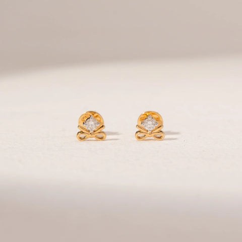 Front view of Bow Diamond Earrings in 14KT Yellow Gold, featuring round lab-grown diamonds above delicate bow designs.