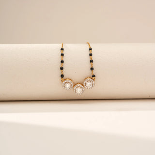 Close-up view of Triple Bloom Round Diamond Mangalsutra in 14KT Yellow Gold, featuring three floral motifs with round lab-grown diamonds.