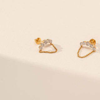 Angled view of Floral Chain Drop Diamond Earrings in 14KT Yellow Gold, featuring round lab-grown diamonds and a delicate chain.
